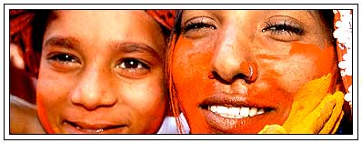 mother celebrate holi with kids