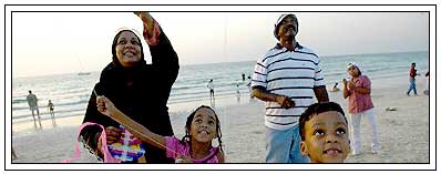 mother celebrate kite festival with kids